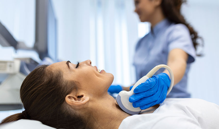 woman patient receives thyroid diagnostics treatment thyrotoxicosis hypothyroidi