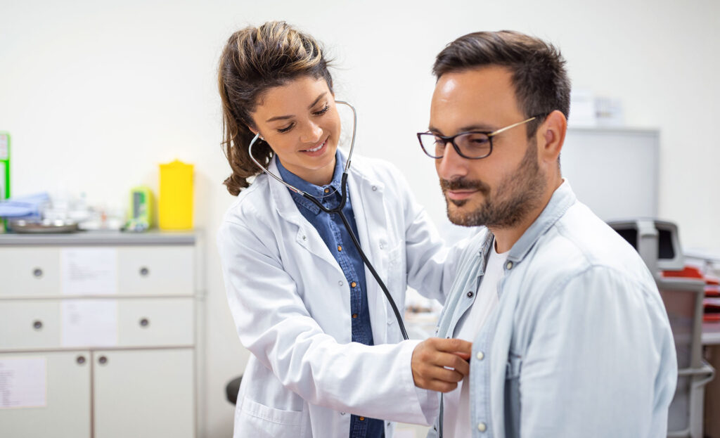 young doctor is using stethoscope listen heartbeat patient shot female doctor gi